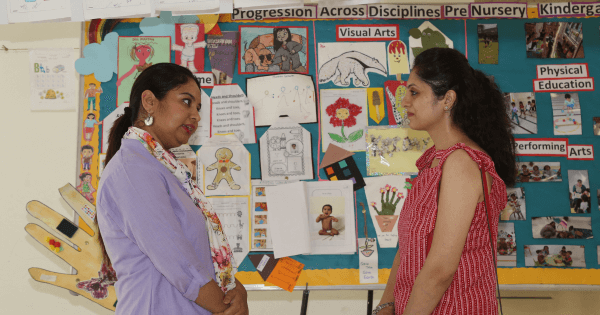 Child engaged in early learning activities with parental support